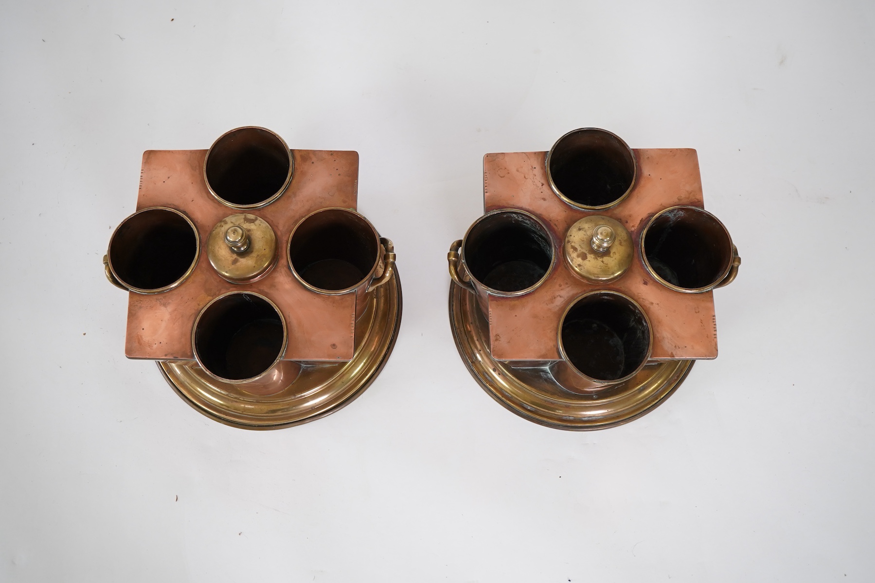 A pair of Art Deco copper and brass champagne/wine coolers, from the passenger ship SS Boston (1924-1942)